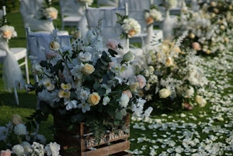 white and yellow flowers on brown wooden table