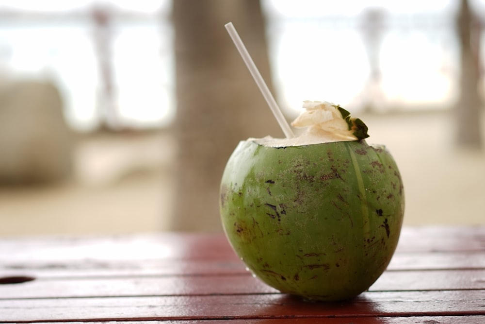 green fruit on brown wooden table