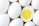 A close-up view of several white eggs with one egg halved to reveal its bright yellow yolk and firm white egg white.