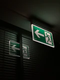 white and green exit sign