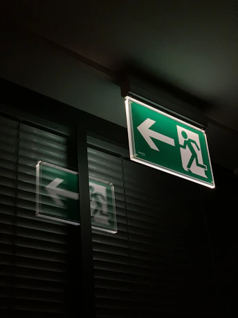 white and green exit sign