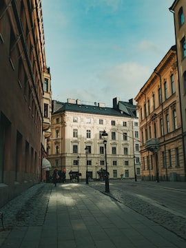 people walking on sidewalk near building during daytime