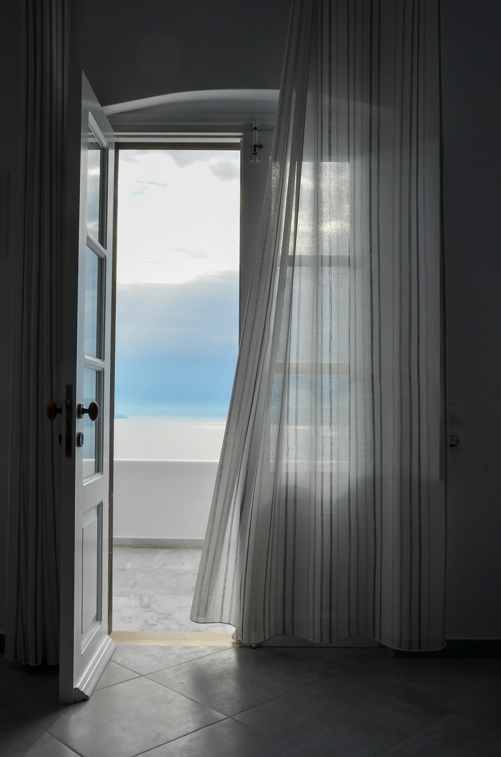 white curtains on white wooden framed glass window