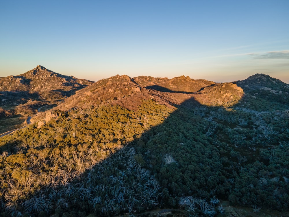 brown mountain under blue sky during daytime