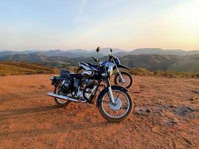 black and gray motorcycle on brown field during daytime