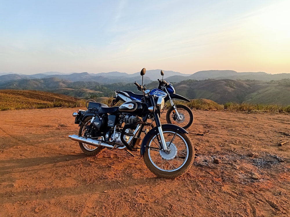 black and gray motorcycle on brown field during daytime