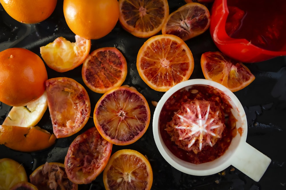 sliced orange fruit on white ceramic plate