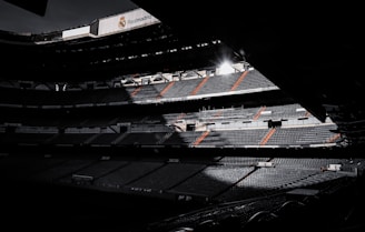 black and white stadium during night time