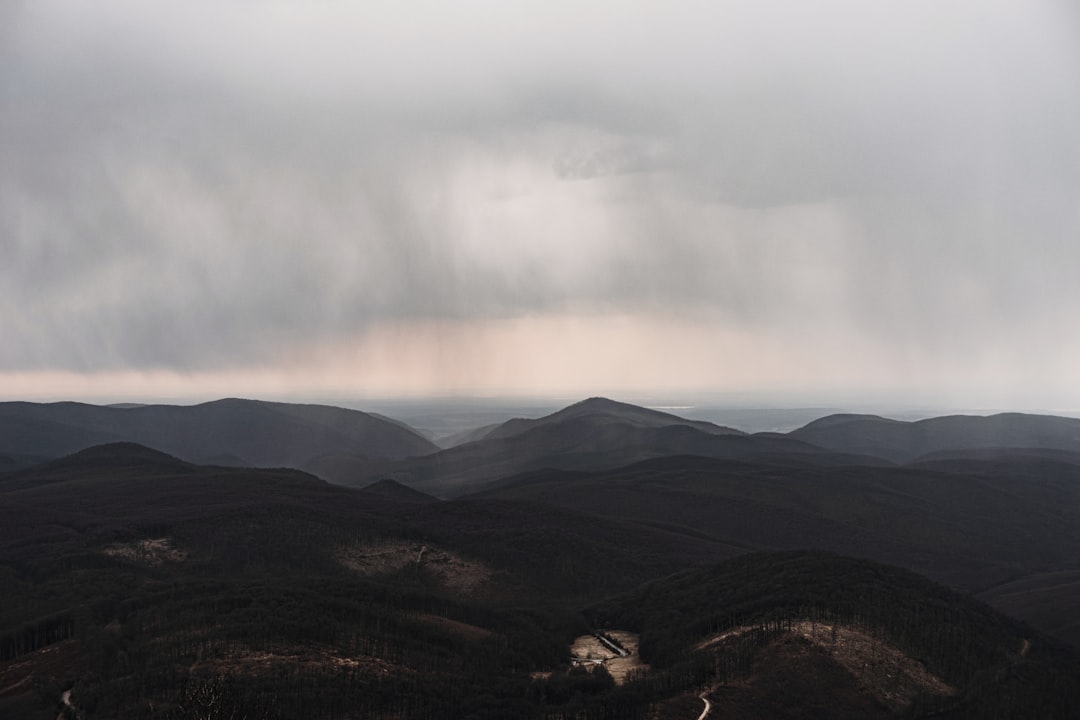 mountains under white clouds during daytime