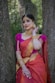 woman in red and blue sari dress