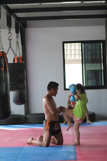 2 boys playing on purple mat