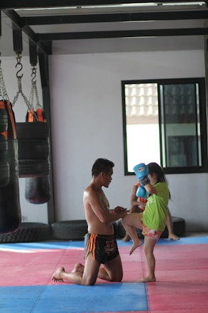 2 boys playing on purple mat