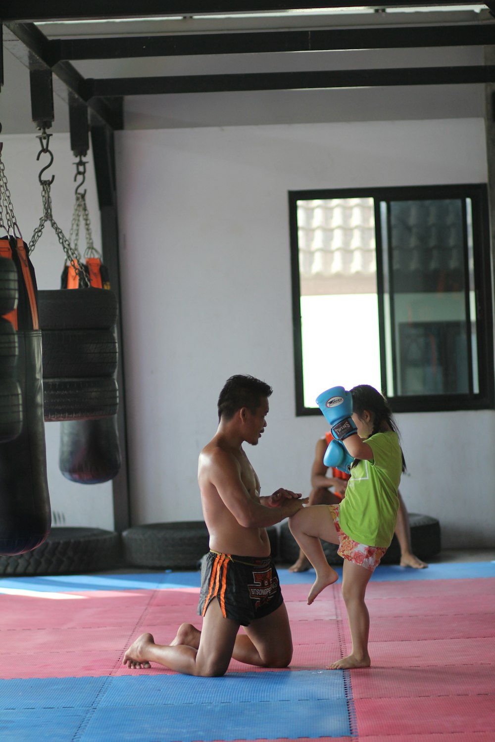 2 boys playing on purple mat