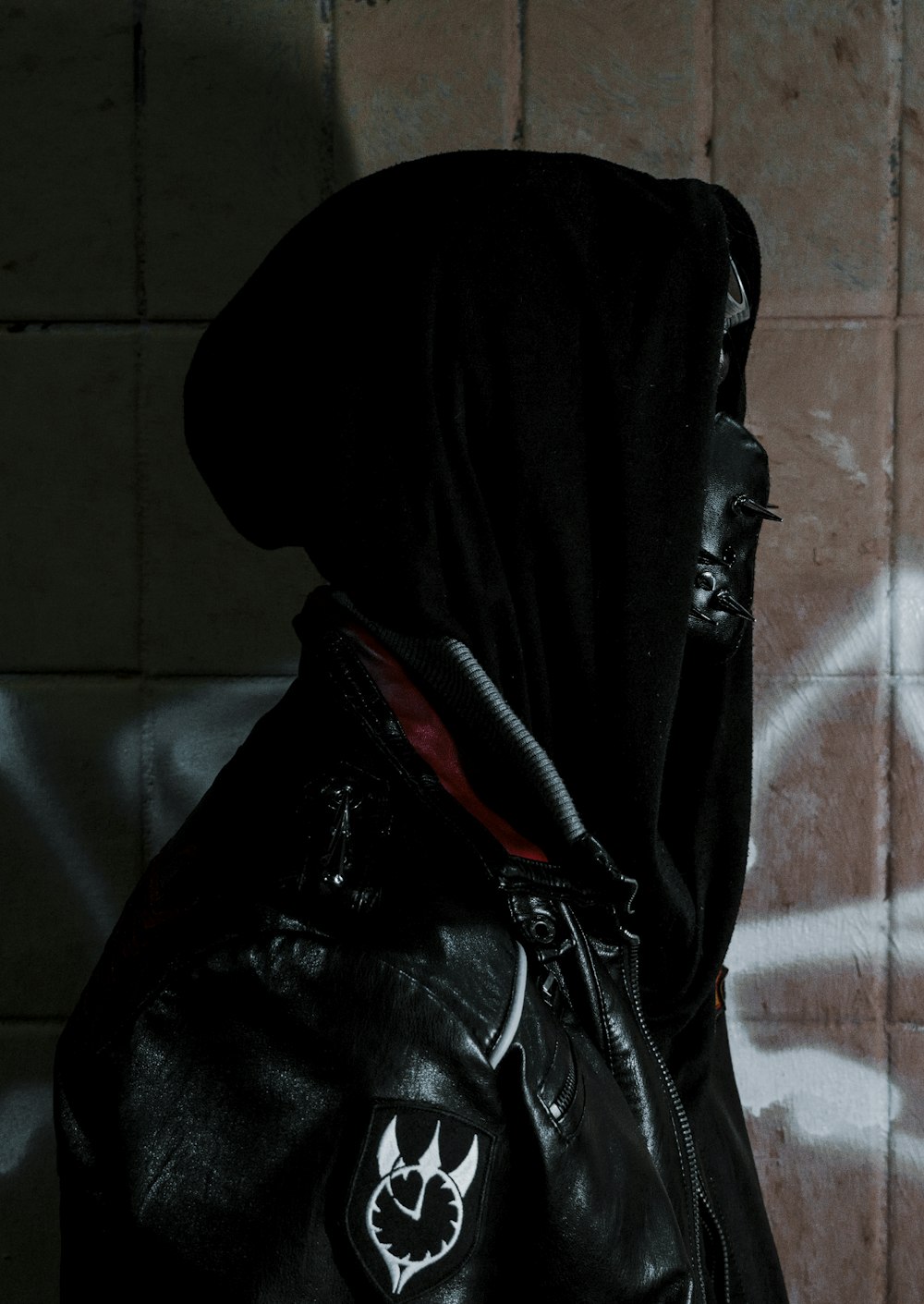 black leather jacket on brown wooden table