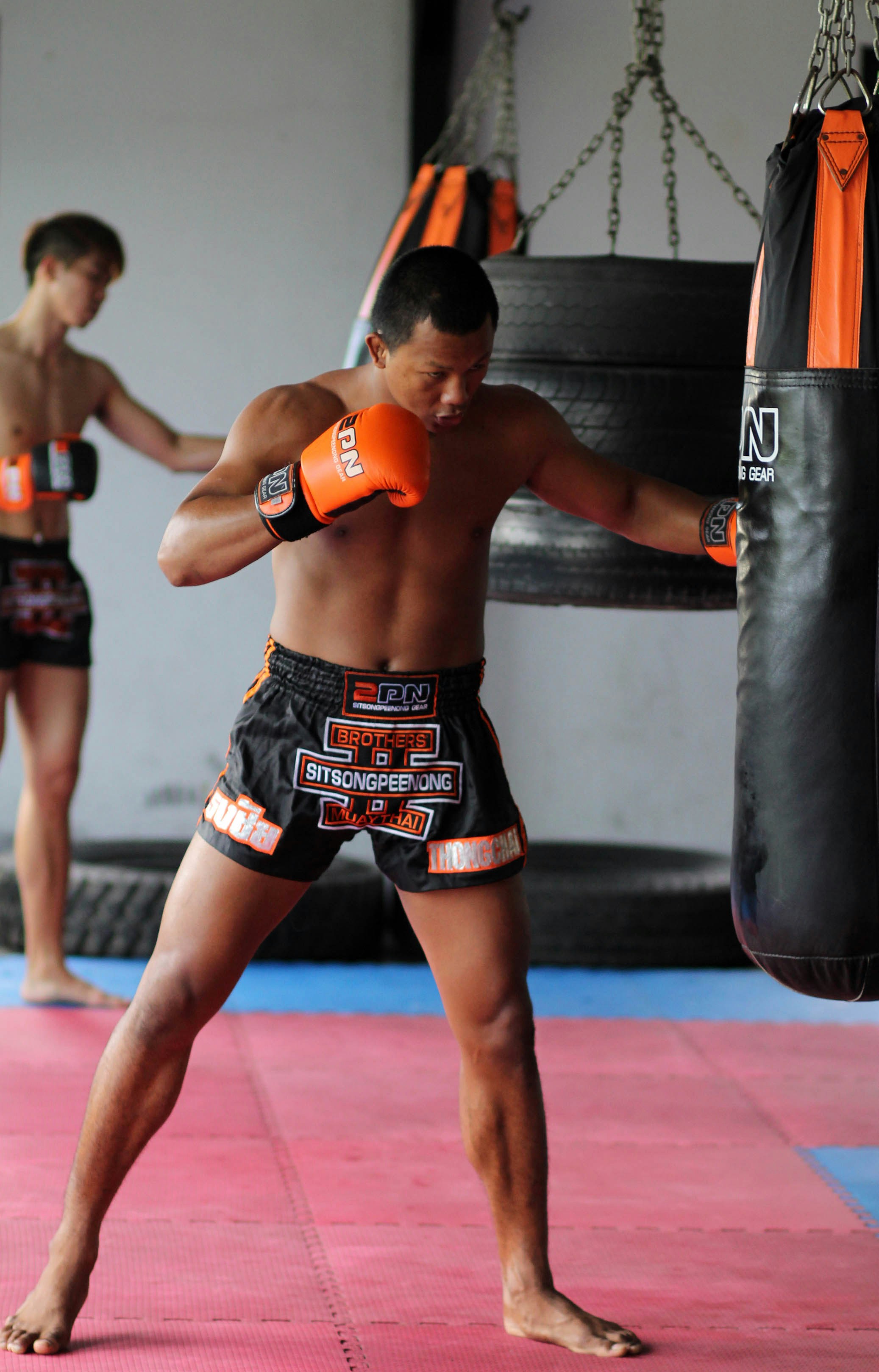 man in black and red boxing gloves