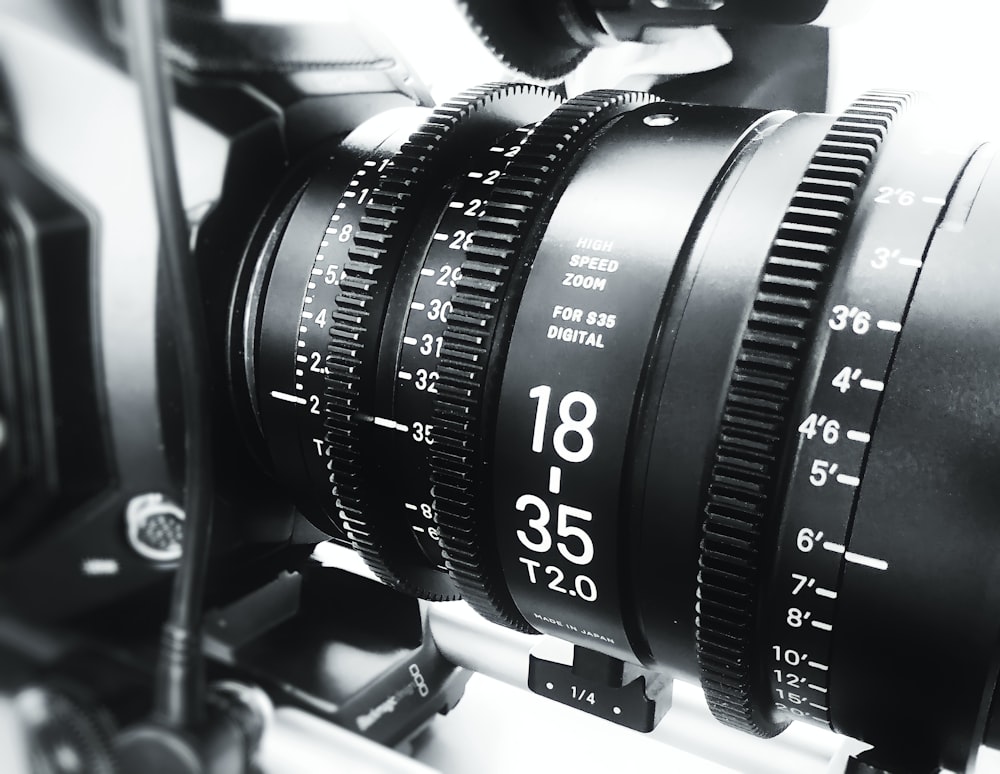 black camera lens on white table