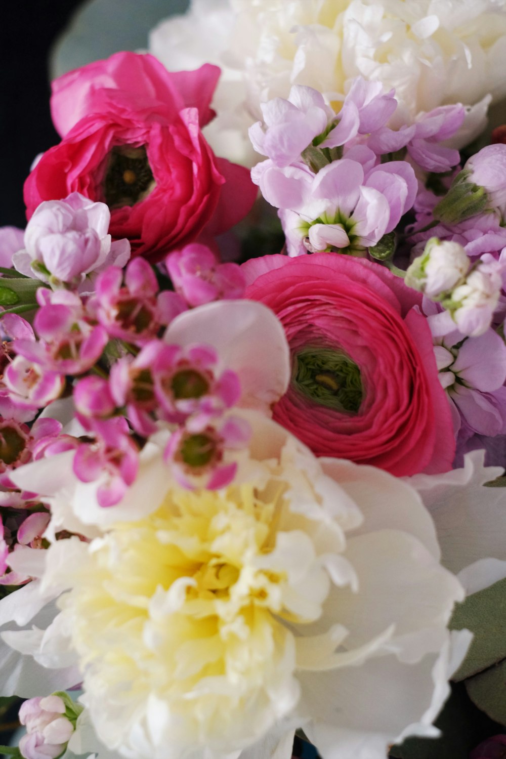 pink and yellow flowers on white table