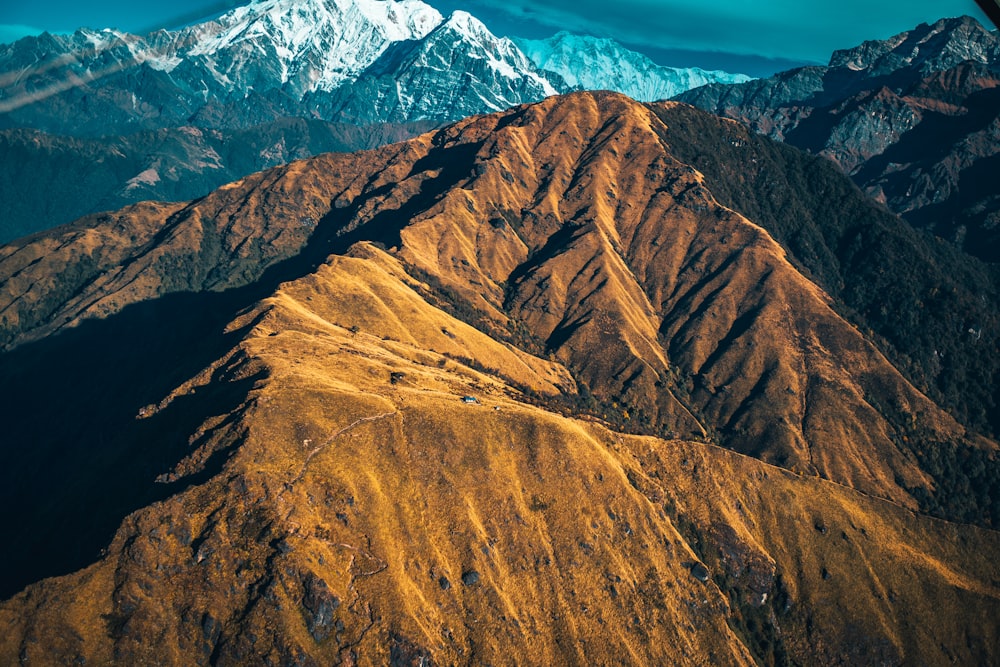 brown and white mountains under blue sky during daytime