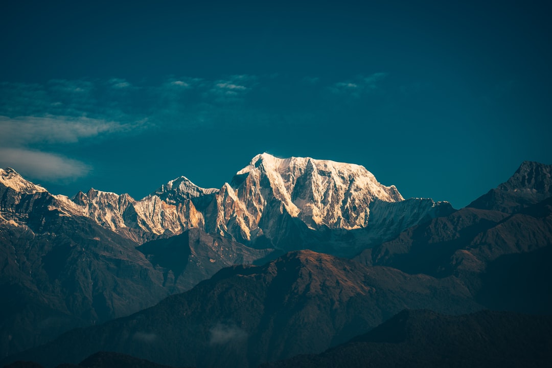 snow covered mountain under blue sky