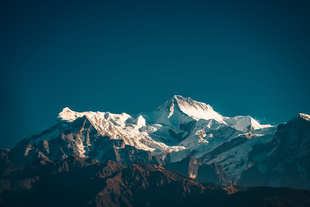 snow covered mountain under blue sky during daytime