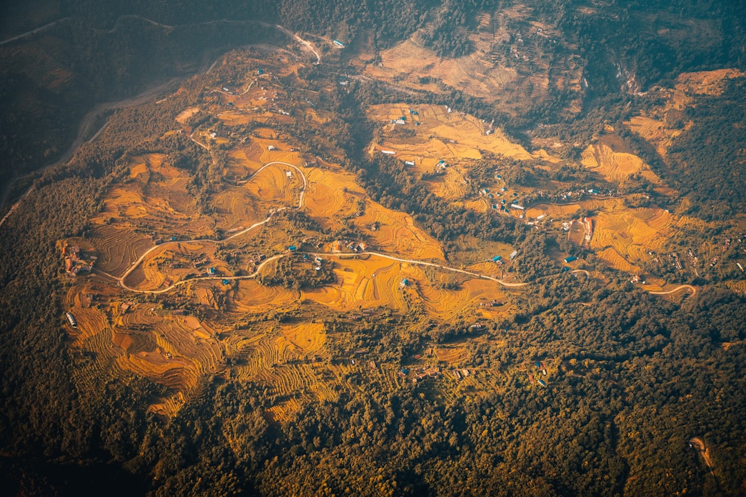 aerial view of brown and green mountains during daytime