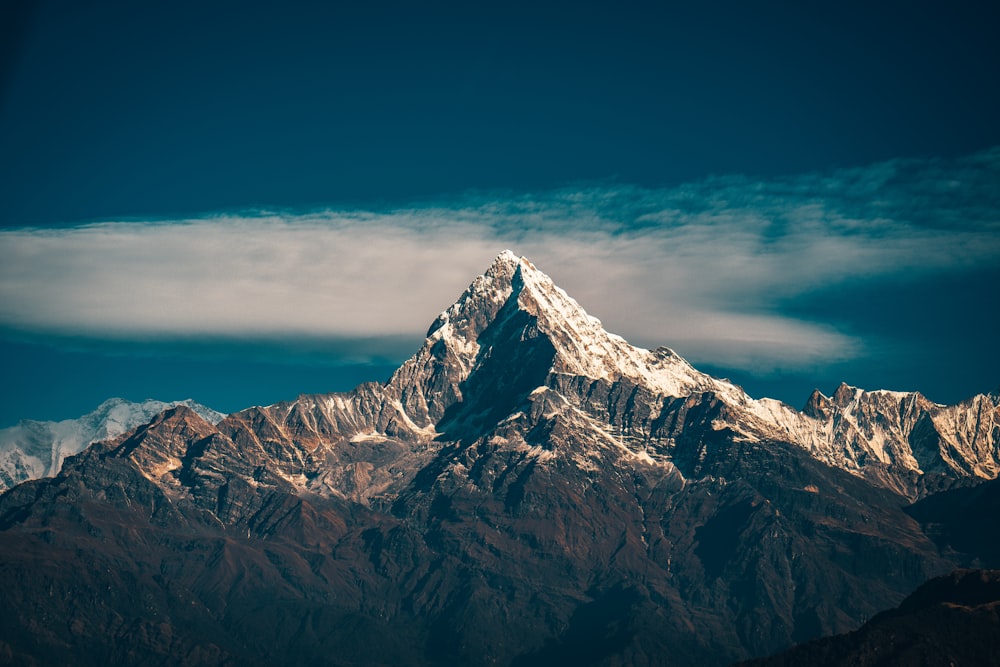 snow covered mountain under blue sky during daytime