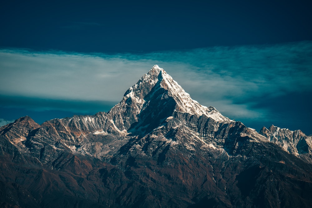 snow covered mountain under blue sky during daytime