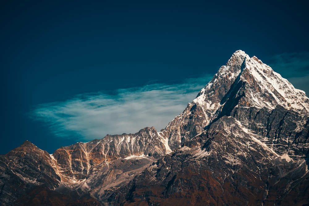 brown and white rocky mountain under blue sky during daytime