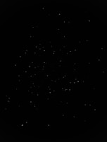 A constellation of satellites forming a network in the dark expanse.