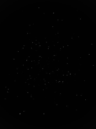 A satellite orbiting the dark expanse of space with distant stars twinkling.