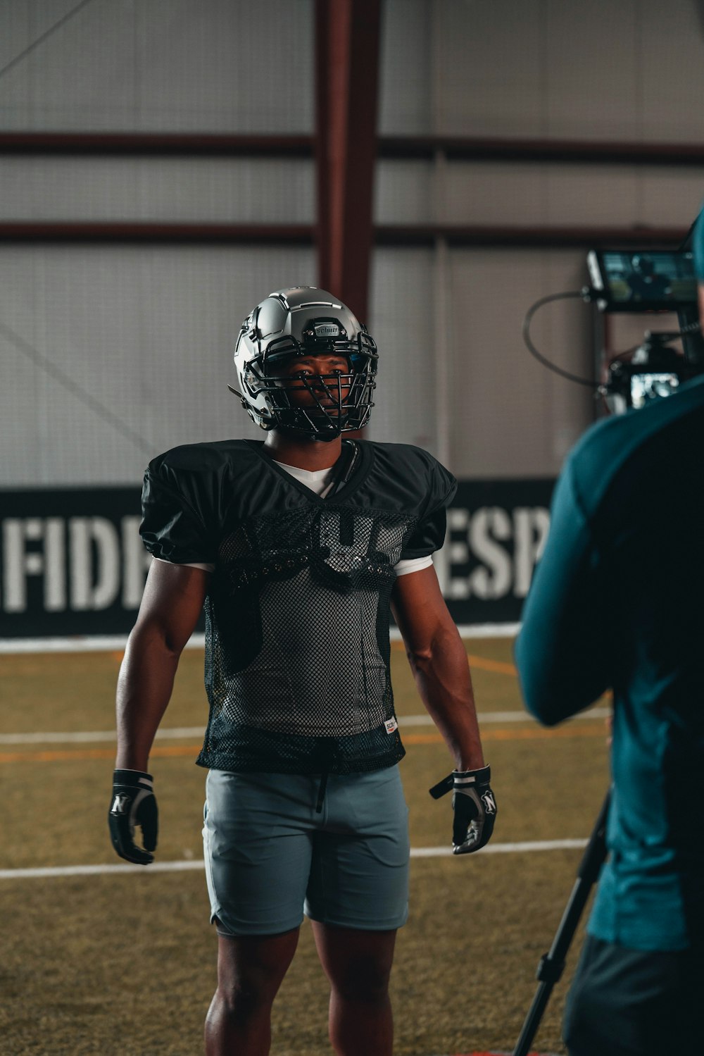 man in blue jersey shirt wearing black helmet