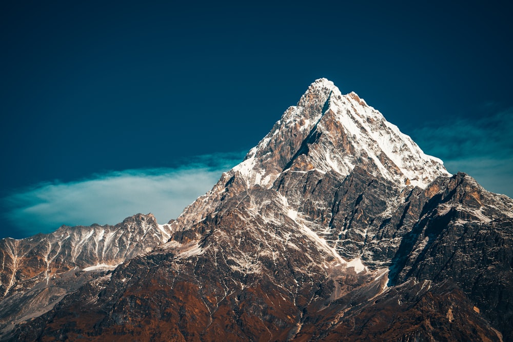 snow covered mountain under blue sky during daytime