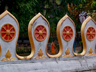 Beautifully designed fence with fine carpentry details and subtle metallic gold accents.
