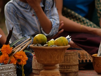 Close-up of a ceremonial piece with sage, tobacco offerings, and drumming tools.