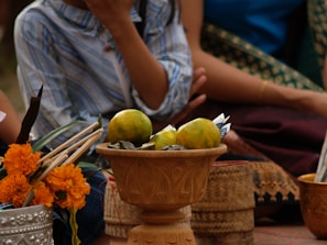 Close-up of symbolic ritual tools laid out carefully on a cloth with ancestral patterns.