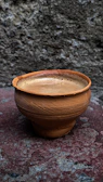 Freshly brewed coffee served in a rustic cup at Elis Cafe.