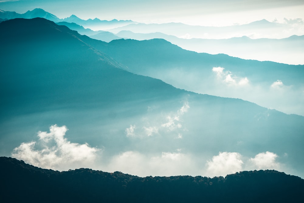 mountain ranges covered in clouds