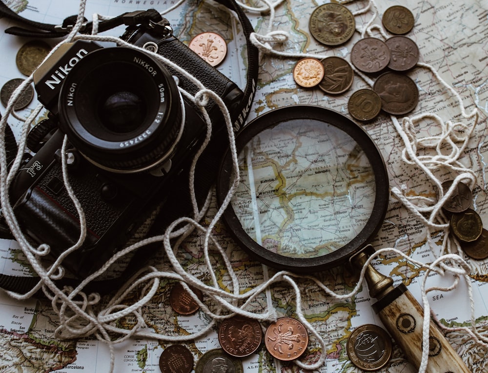 black nikon dslr camera on brown wooden table