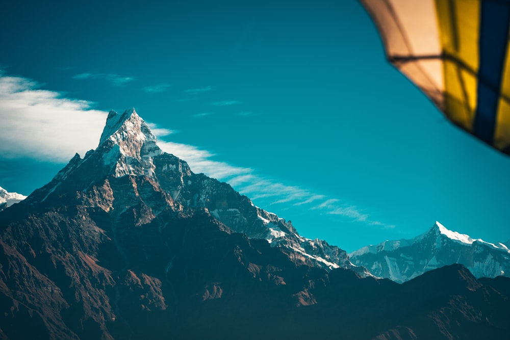 snow covered mountain under blue sky during daytime