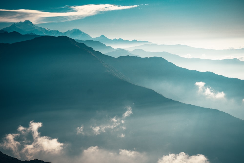 black mountains under white clouds during daytime