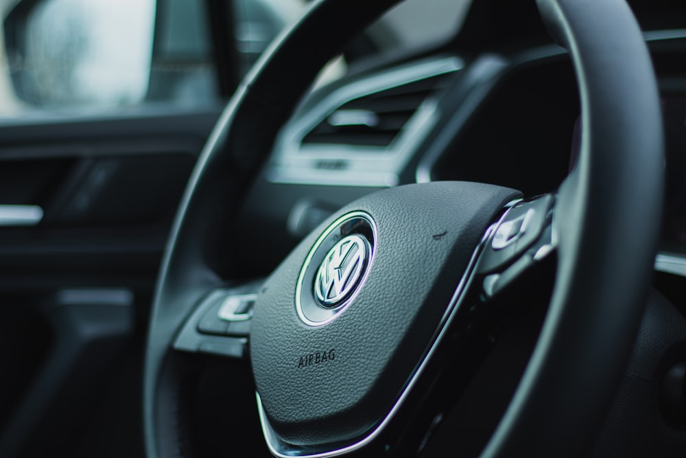 black and silver mercedes benz steering wheel