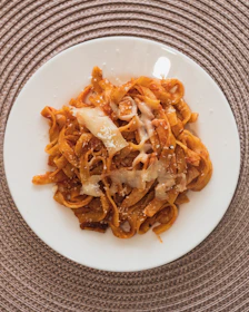 A hearty parmegiana dish with melted cheese and tomato sauce, steaming hot.