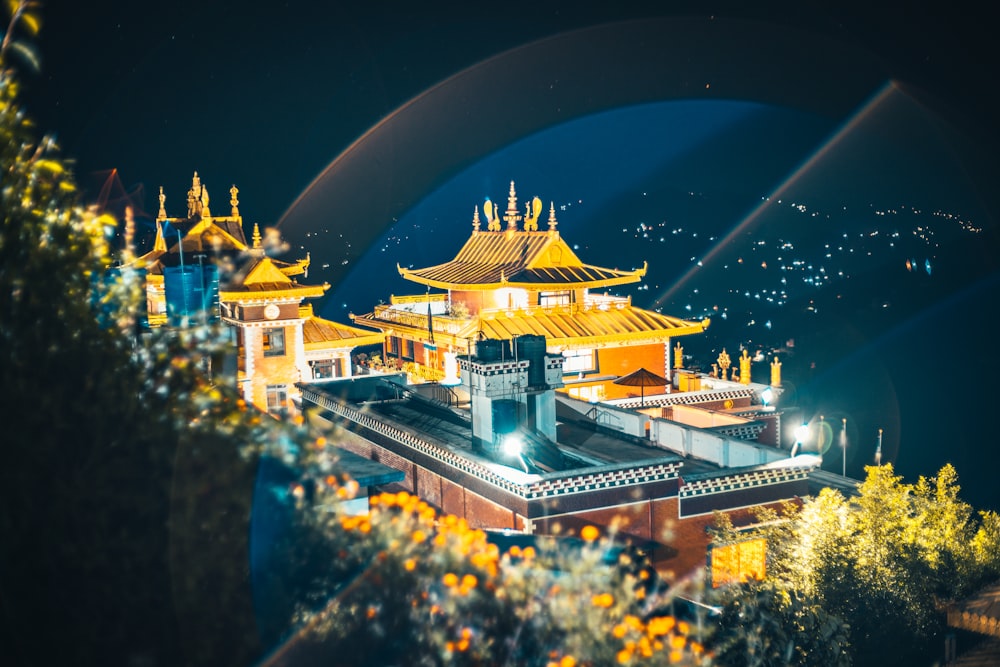 white and gold temple during night time