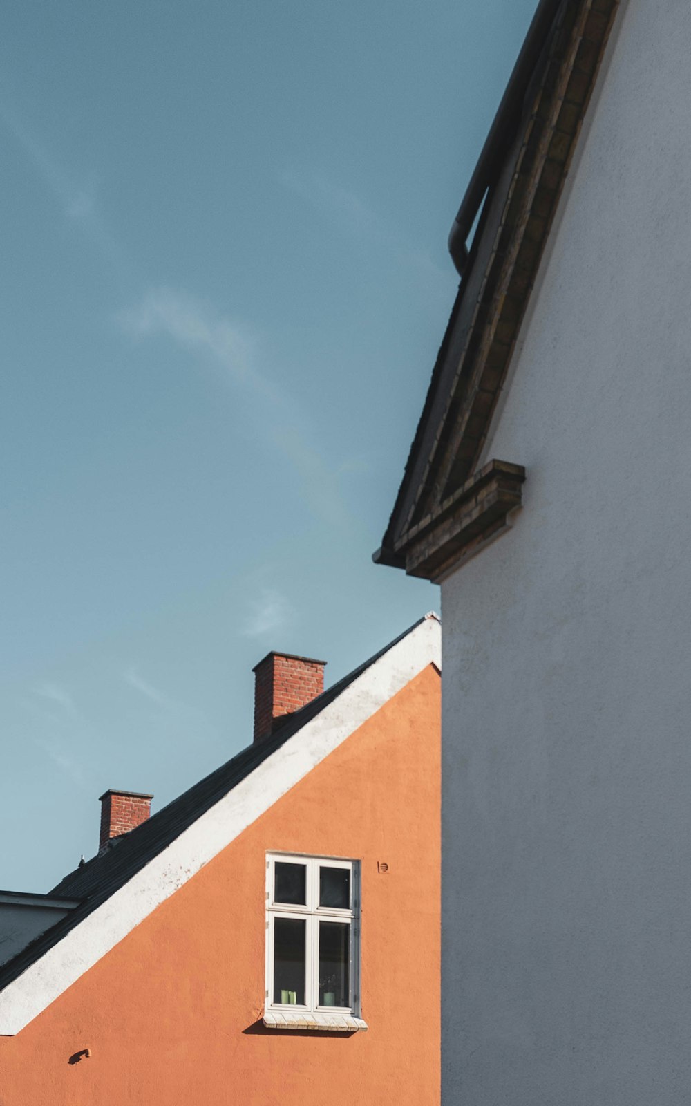 brown and white concrete building under blue sky during daytime