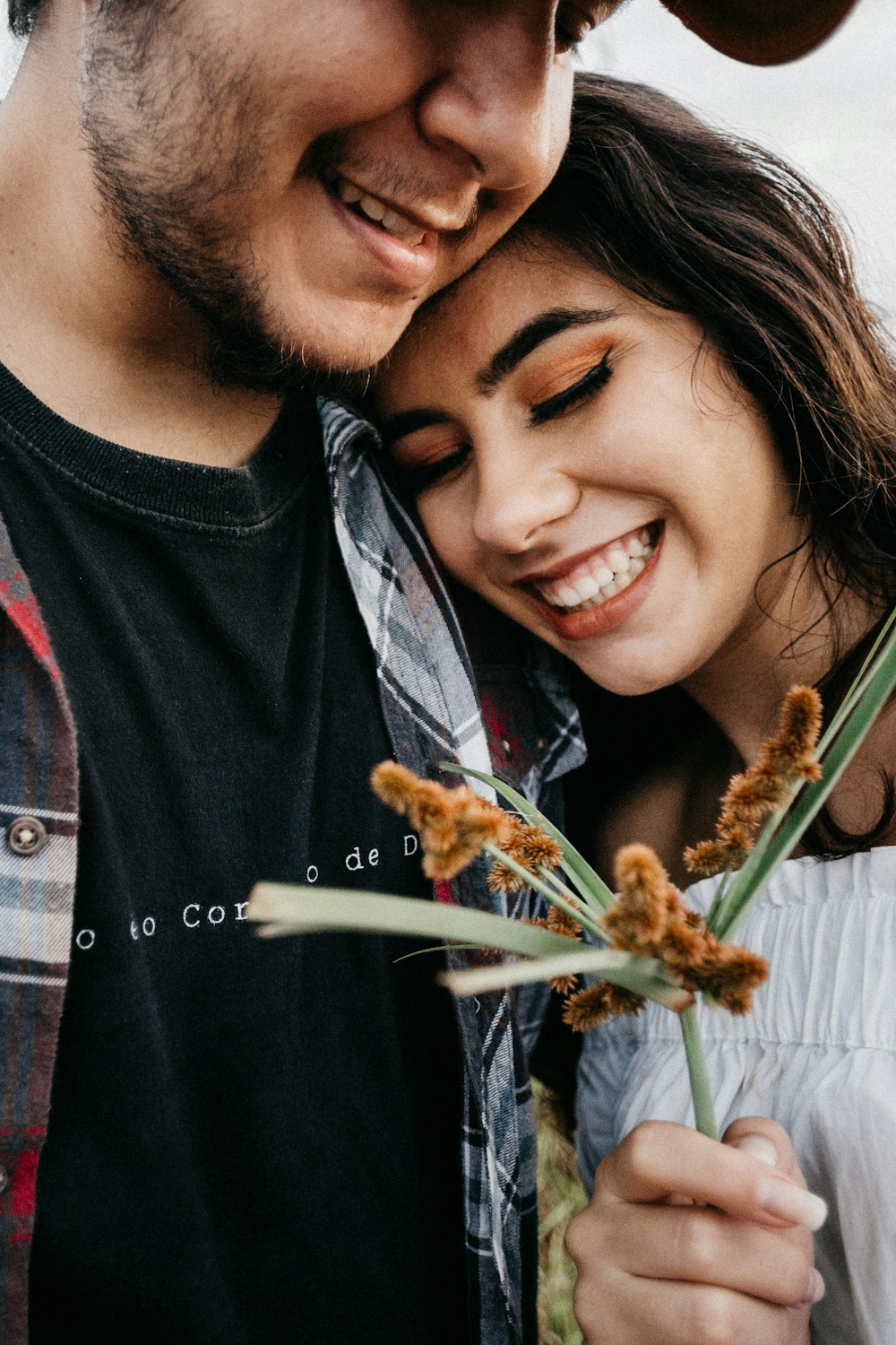 man in black crew neck shirt beside woman in gray crew neck shirt