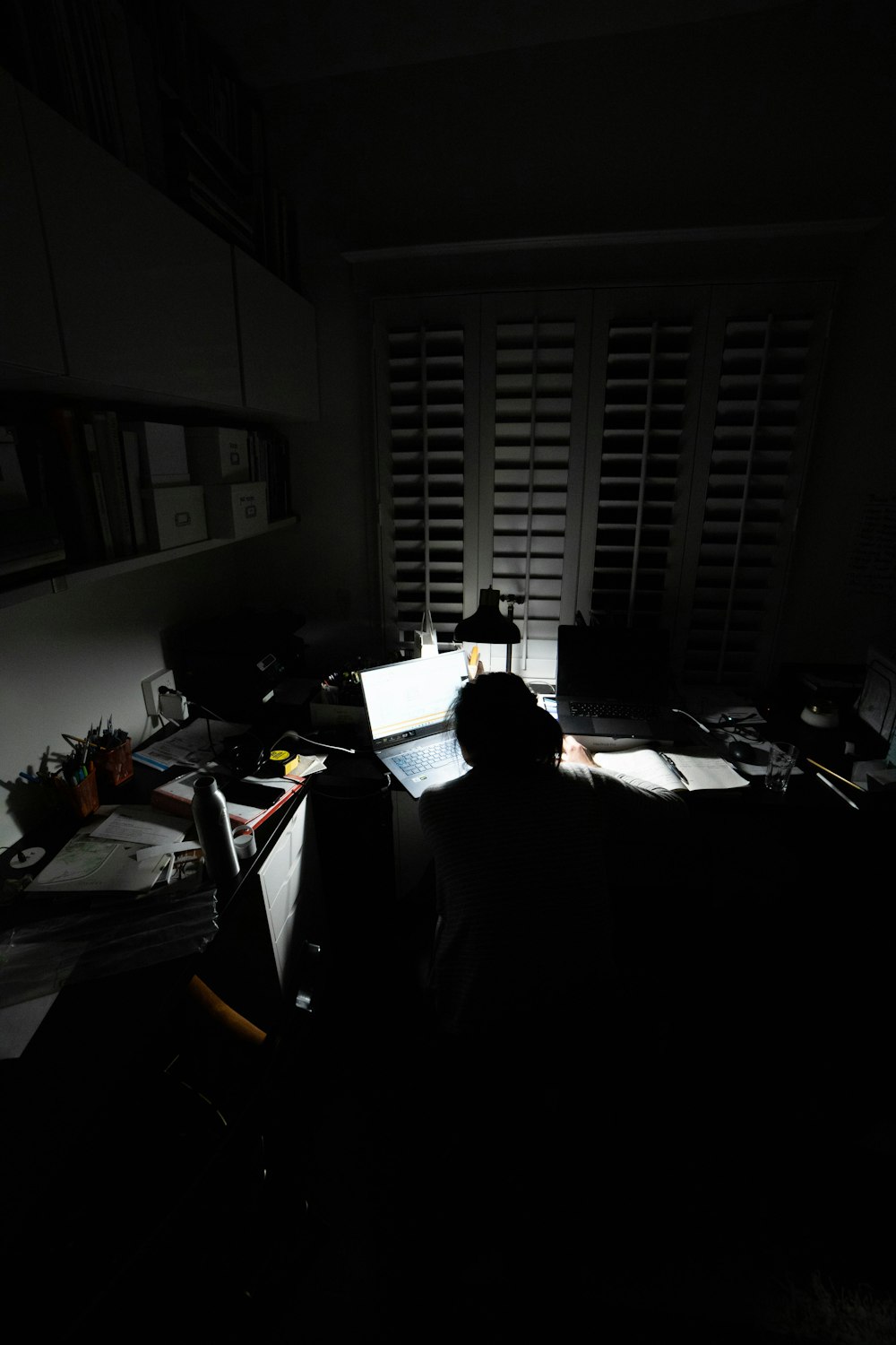 person sitting on chair in front of computer