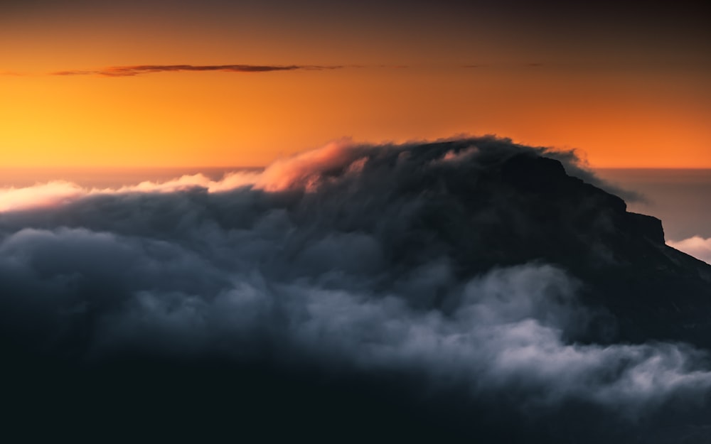 white clouds and orange sky during sunset