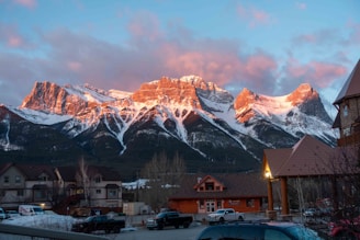 Snow-capped Dolomites glowing at sunset as seen from thealpinerelax apartments