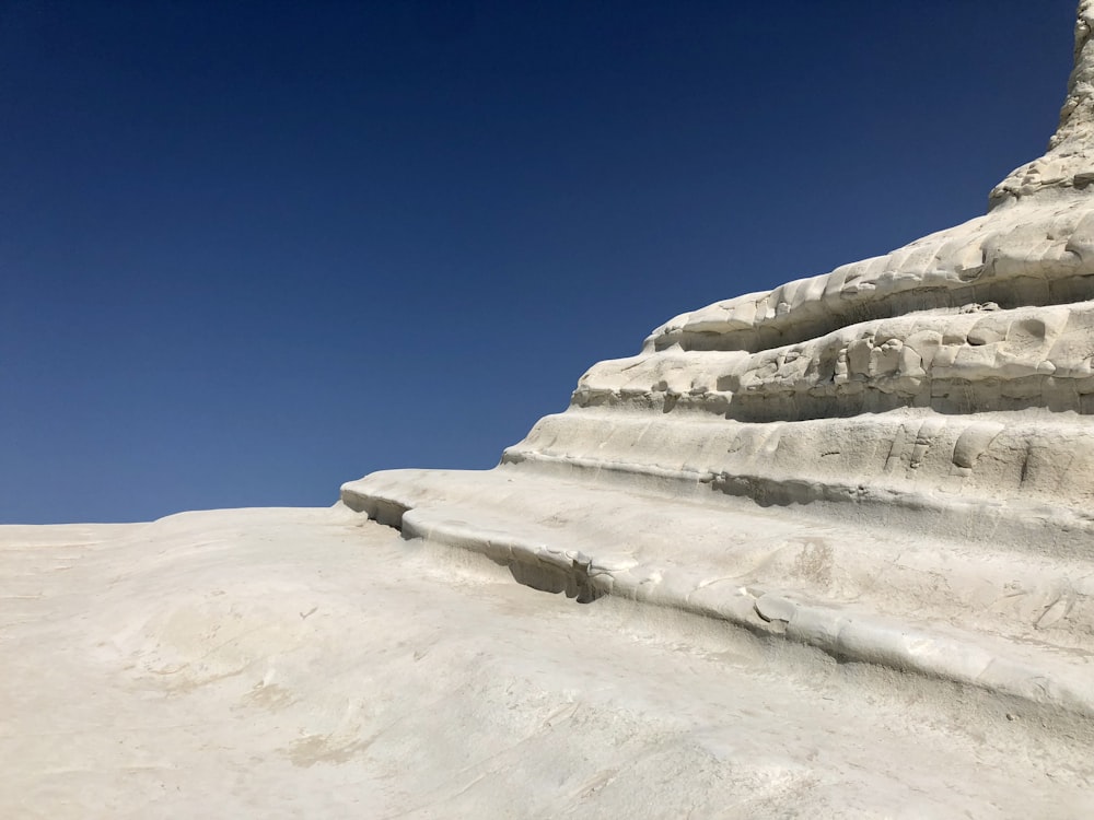 brown rock formation under blue sky during daytime