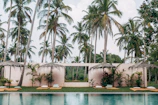 Family enjoying a peaceful moment beside the pool area at Serenkampot.